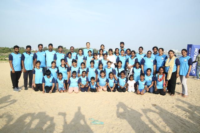 The Happy Yogis group photographed together at the beach session