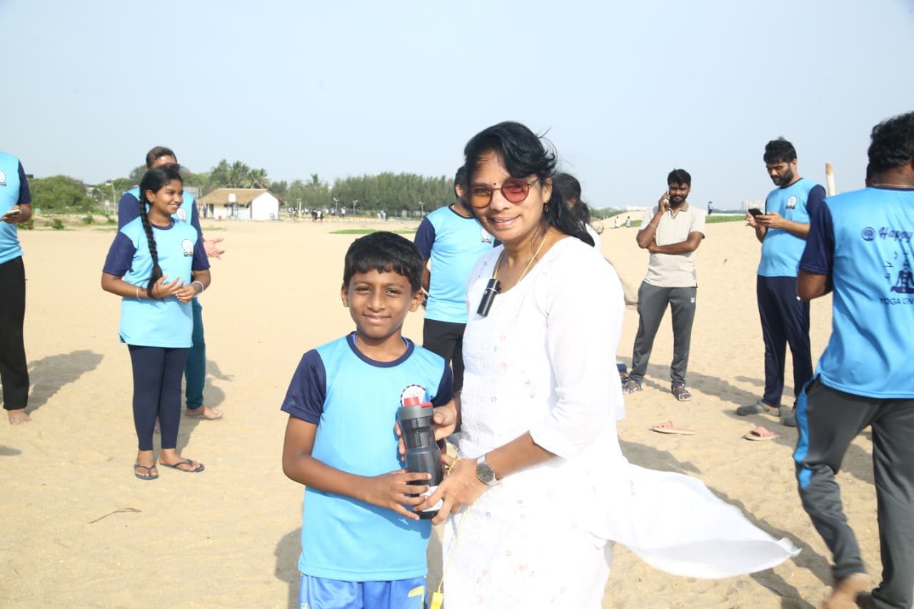 The teacher with one of the younger students after the challenge