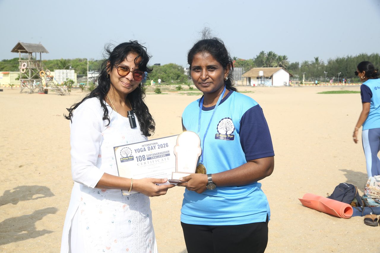 A finisher receiving her certificate and memento